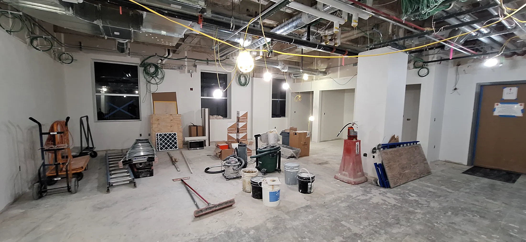 Interior construction progress at the St. Joseph Hospital Tower C Integrated Care Campus with overhead systems exposed